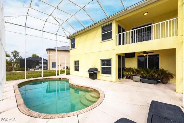 a view of a swimming pool with a lounge chairs