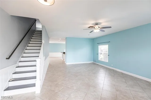 a view of entryway and hall with a ceiling fan