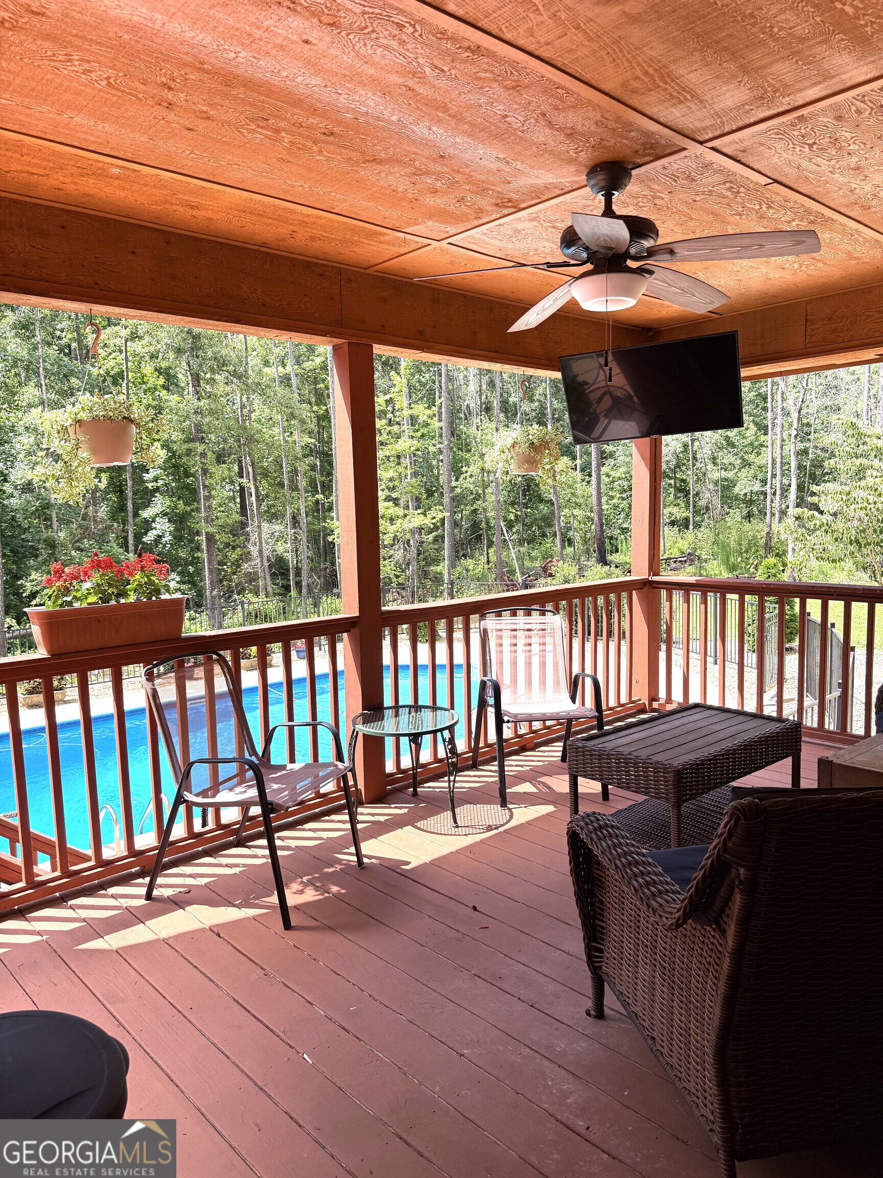 725 Musgrove Road Griffin, GA 30223 - Photo 39 of 52 a view of a porch with furniture and wooden floor