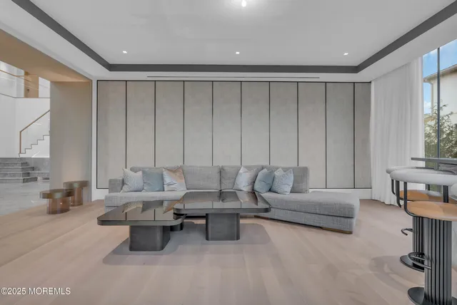 a bathroom with a sink and mirror with toilet
