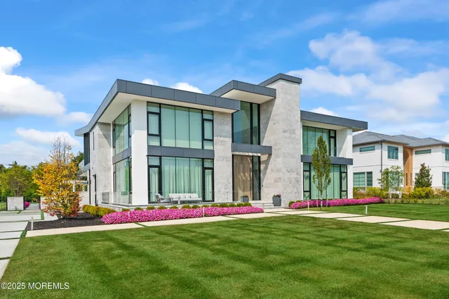a view of a room with furniture and wooden floor