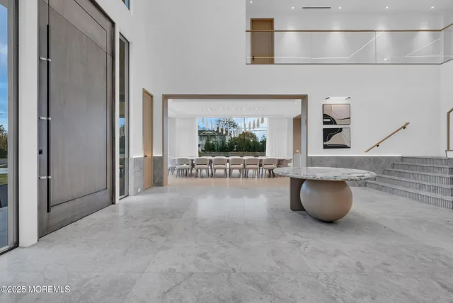 a kitchen with a sink a stove and chairs