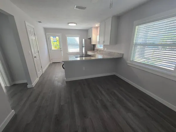 a view of an empty room with a window