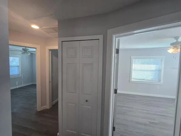 a bathroom with a sink a toilet a mirror and window