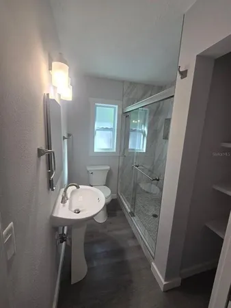 a bathroom with a sink and mirror