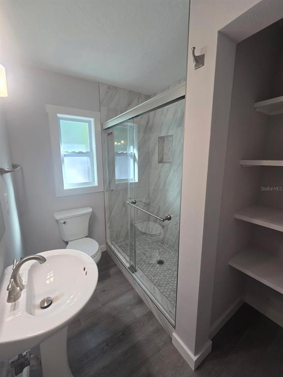 107 29th Street Holmes Beach, FL 34217 - Photo 10 of 13 a bathroom with a sink and mirror