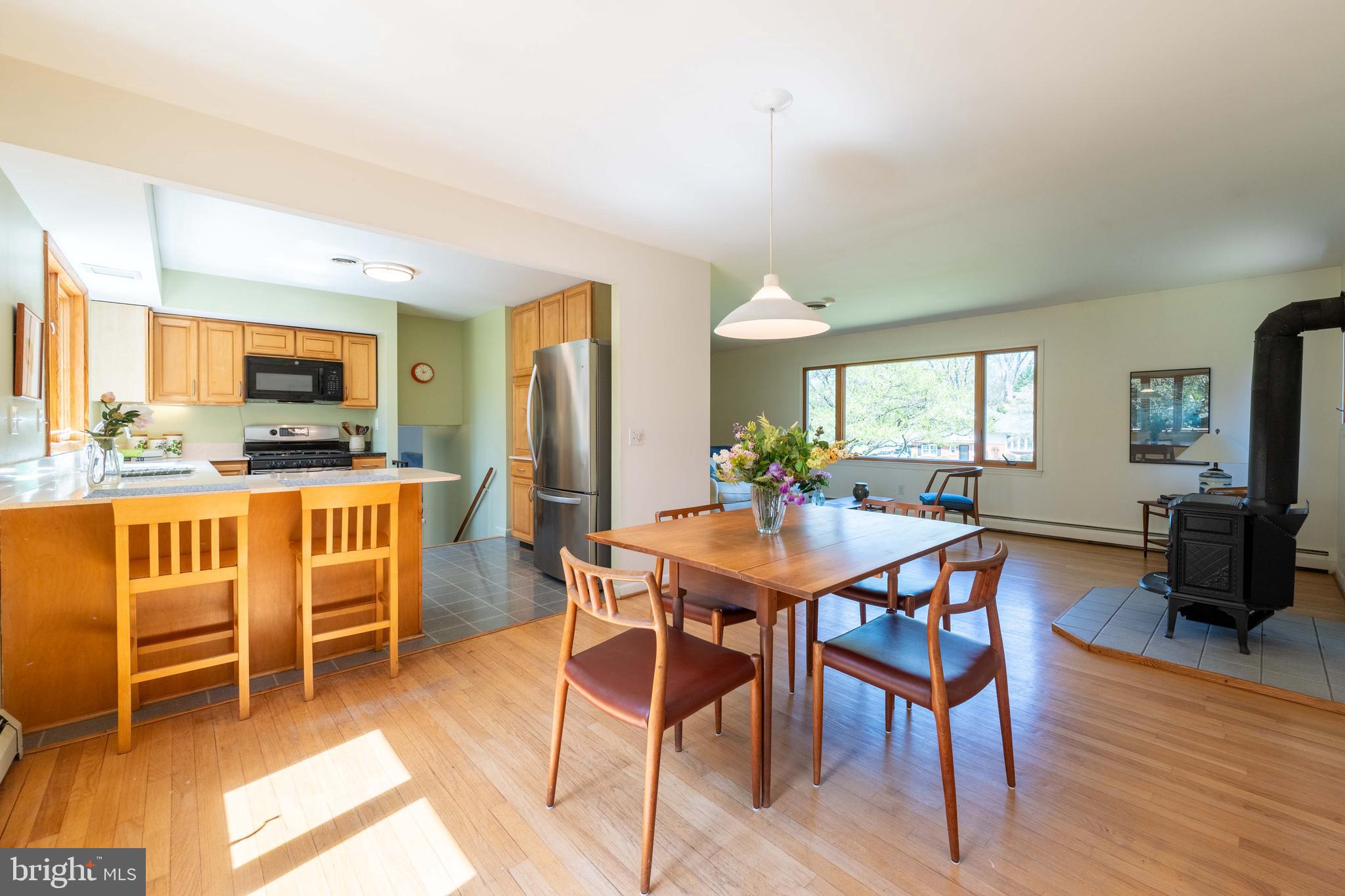 9221 Spring Valley Road Ellicott City, MD 21043 - Photo 13 of 47 a dining room with furniture and wooden floor