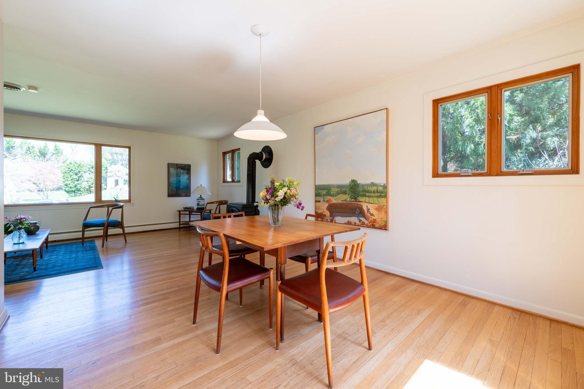 9221 Spring Valley Road Ellicott City, MD 21043 - Photo 14 of 47 a view of a dining room with furniture window and wooden floor
