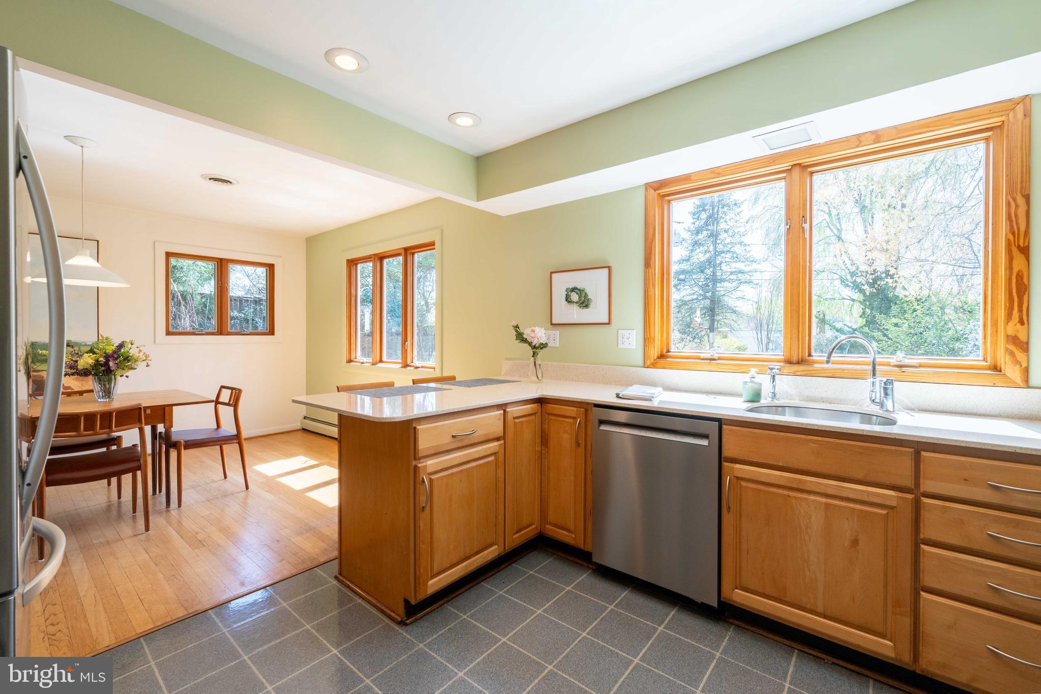 9221 Spring Valley Road Ellicott City, MD 21043 - Photo 17 of 47 a large kitchen with kitchen island granite countertop a large island in the center