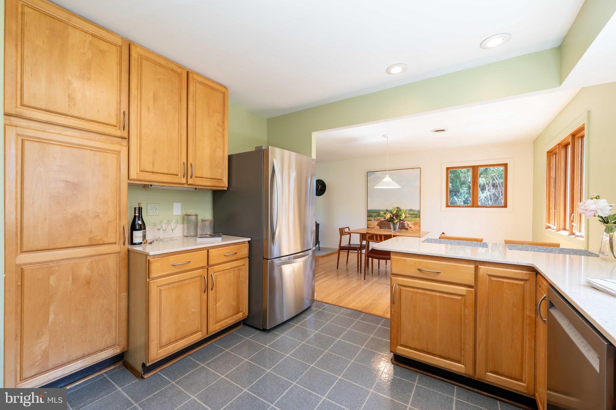9221 Spring Valley Road Ellicott City, MD 21043 - Photo 18 of 47 a kitchen with stainless steel appliances a refrigerator sink and cabinets