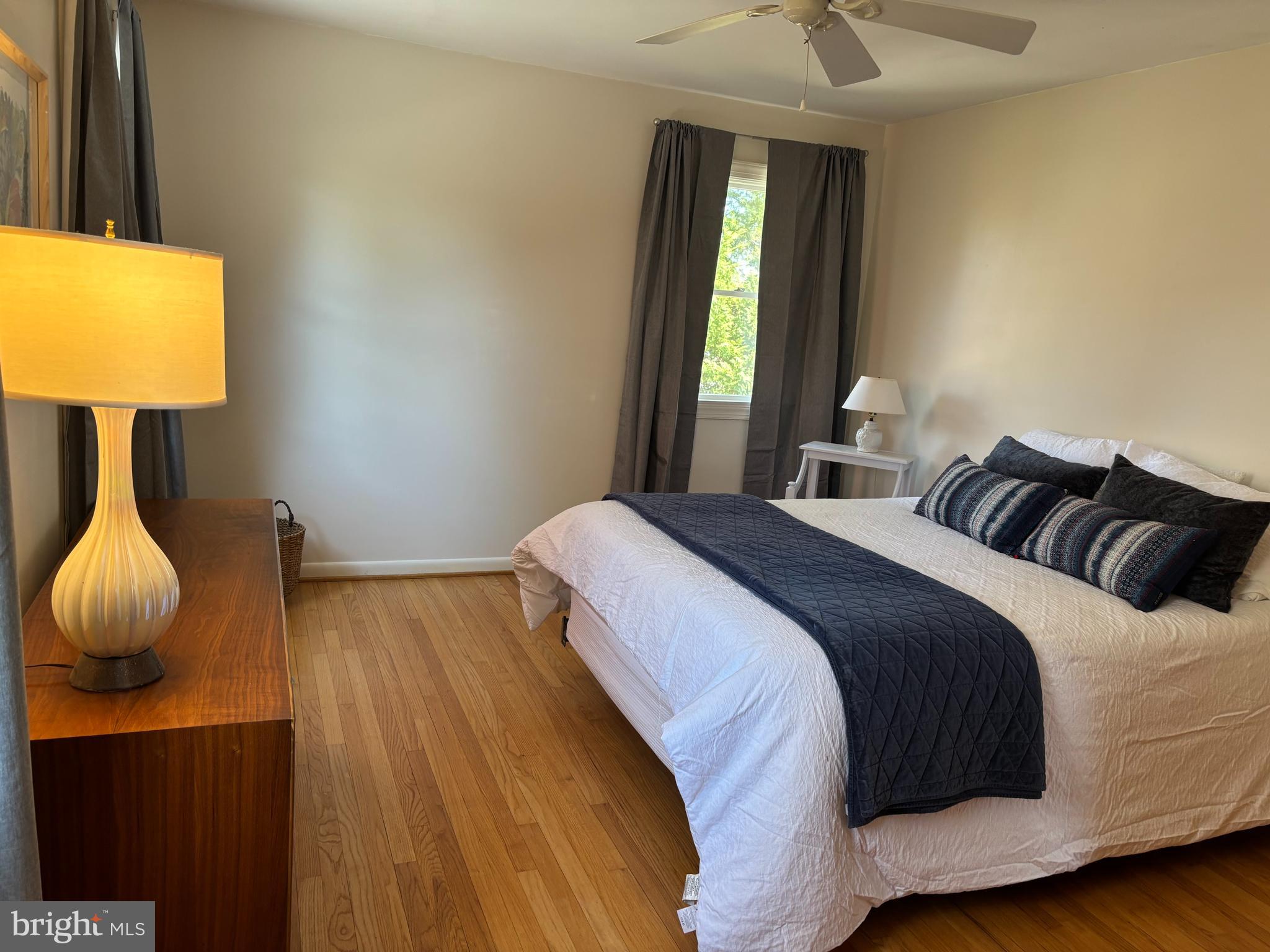 9221 Spring Valley Road Ellicott City, MD 21043 - Photo 20 of 47 a bedroom with a bed and a window