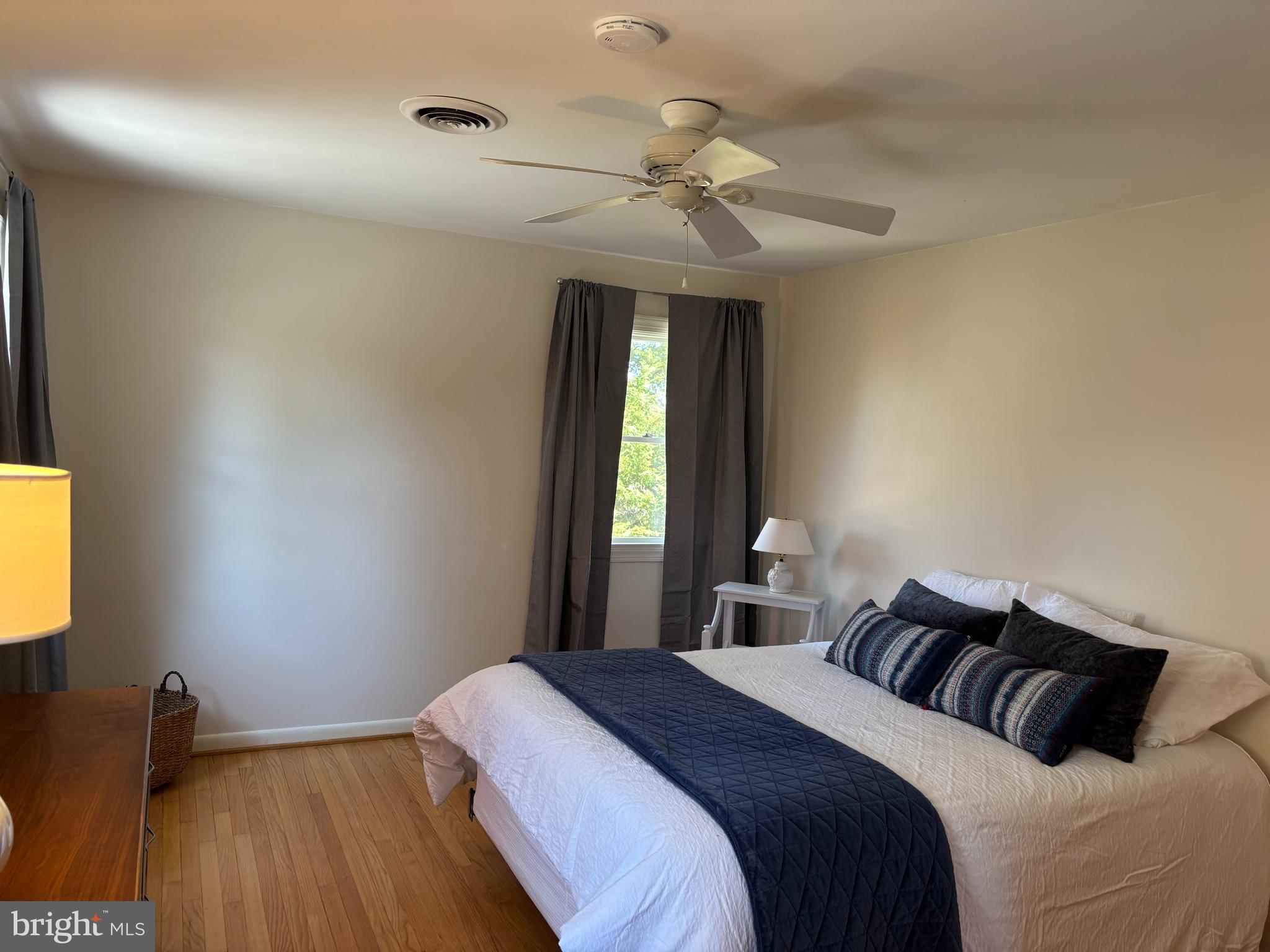 9221 Spring Valley Road Ellicott City, MD 21043 - Photo 22 of 47 a bedroom with a bed and a window
