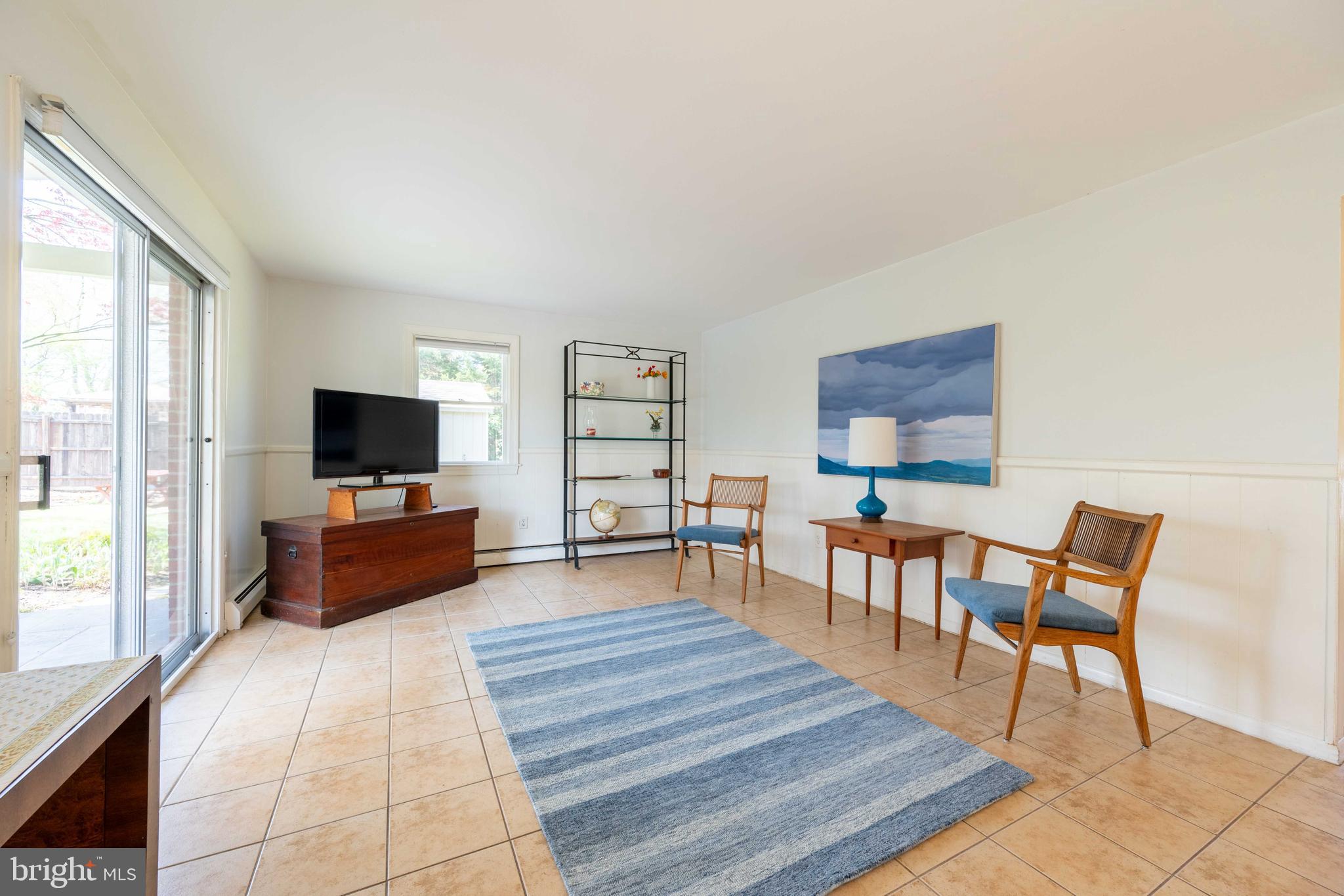 9221 Spring Valley Road Ellicott City, MD 21043 - Photo 29 of 47 a living room with furniture and a flat screen tv