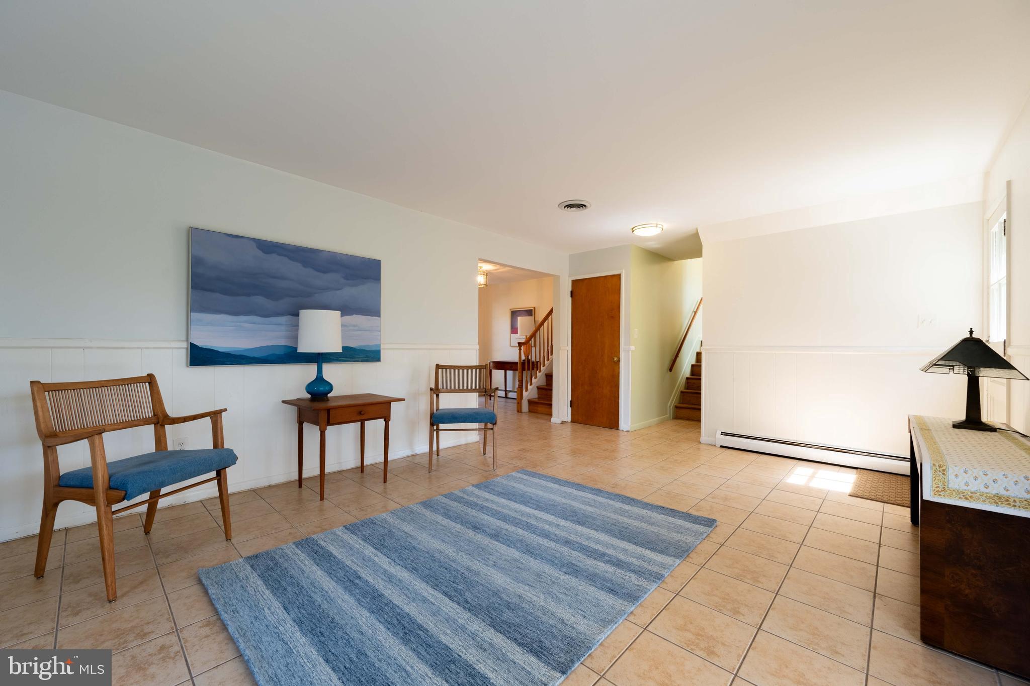 9221 Spring Valley Road Ellicott City, MD 21043 - Photo 30 of 47 a living room with furniture and a wooden floor