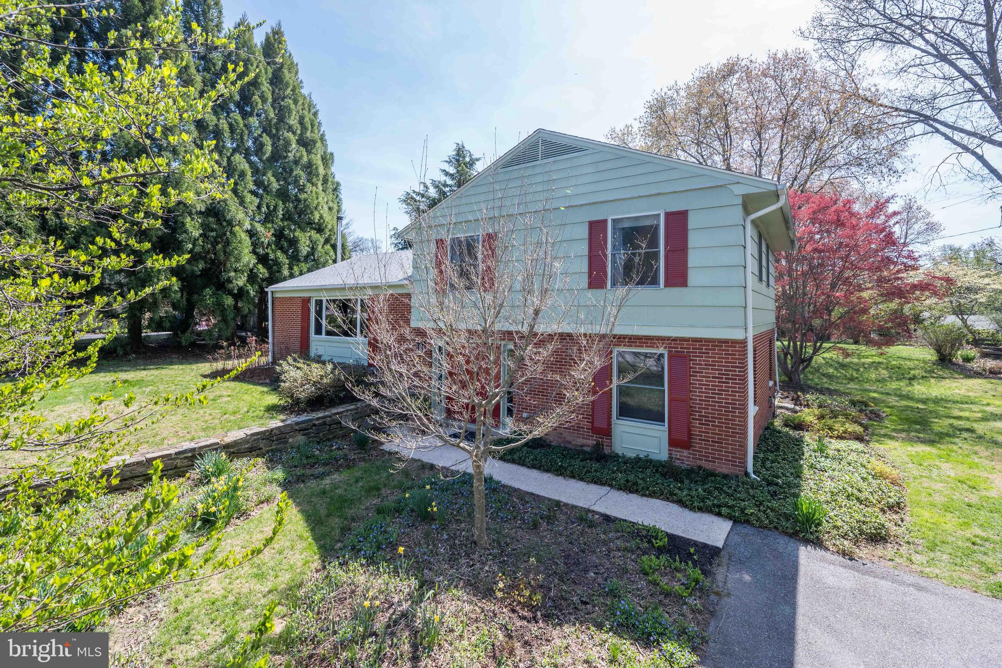 9221 Spring Valley Road Ellicott City, MD 21043 - Photo 3 of 47 a front view of a house with garden