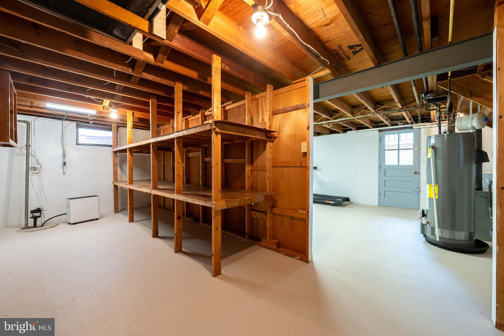 9221 Spring Valley Road Ellicott City, MD 21043 - Photo 35 of 47 a view of an empty room with wooden shelves