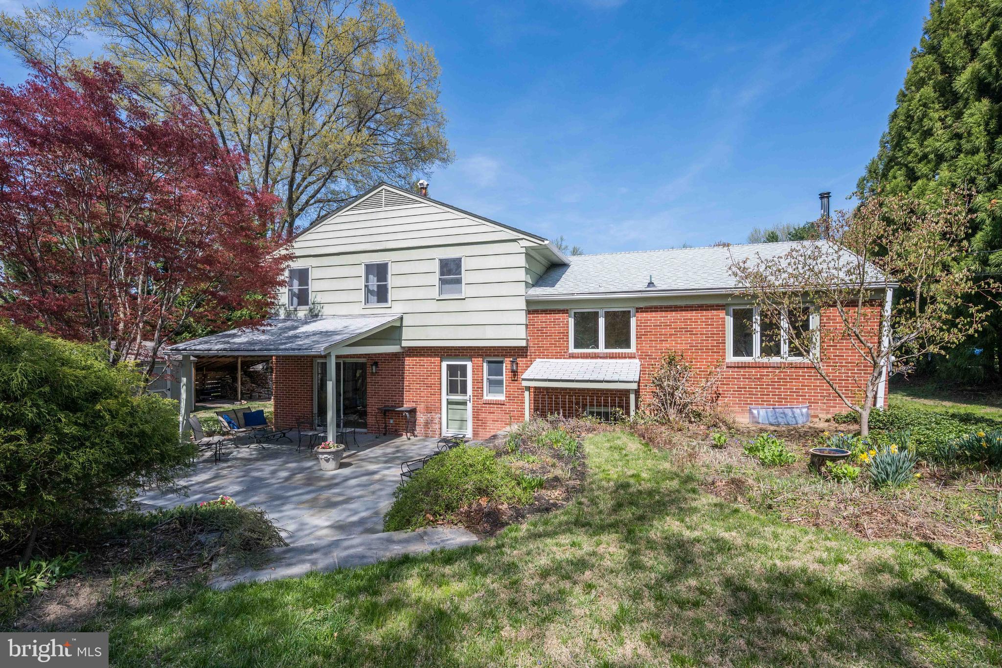 9221 Spring Valley Road Ellicott City, MD 21043 - Photo 40 of 47 a front view of a house with garden
