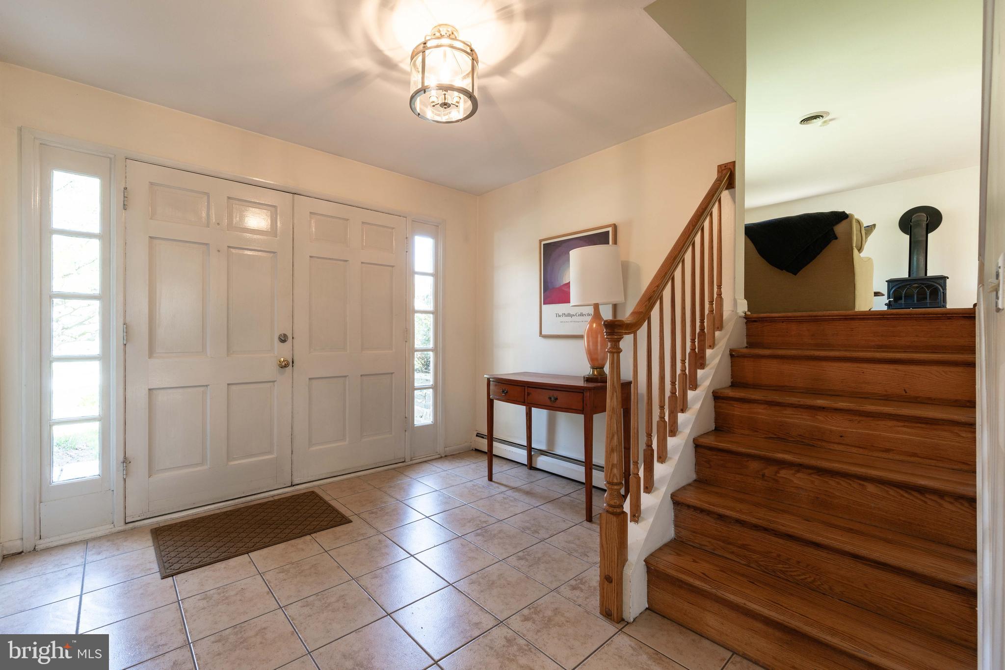 9221 Spring Valley Road Ellicott City, MD 21043 - Photo 7 of 47 a view of entryway and hall with wooden floor