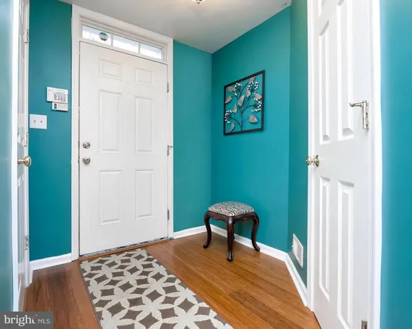 a living room with furniture and a rug