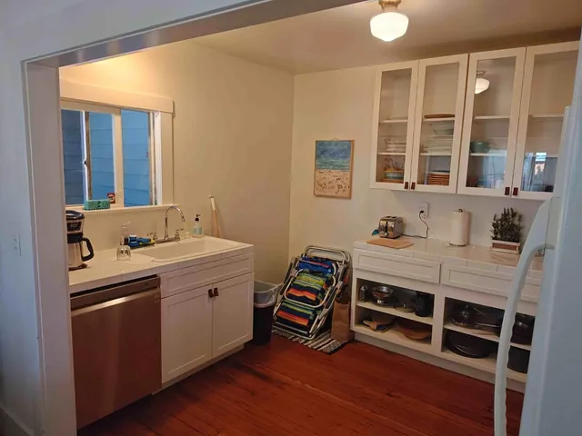 a room with a sink and a mirror