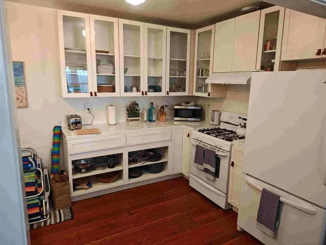 a kitchen with stainless steel appliances a stove and a refrigerator