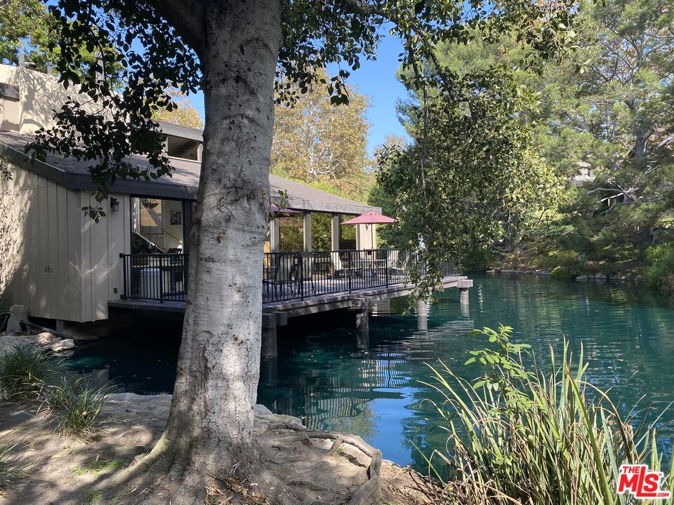 1101 Raintree Circle, Unit 101 Culver City, CA 90230 - Photo 3 of 12 a house view with a lake view