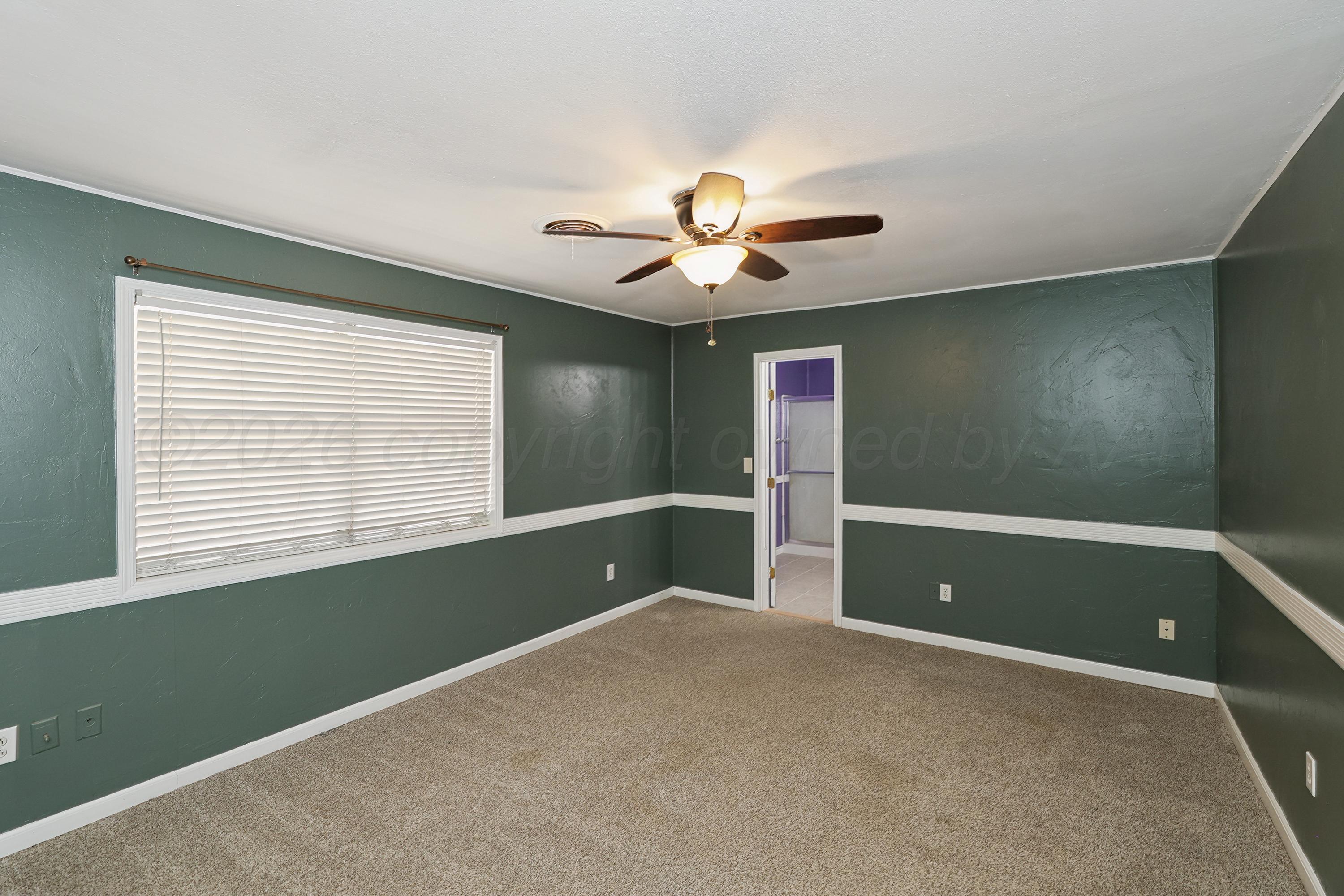 14200 Savannah Road Amarillo, TX 79118 - Photo 12 of 34 a view of room with window and ceiling fan