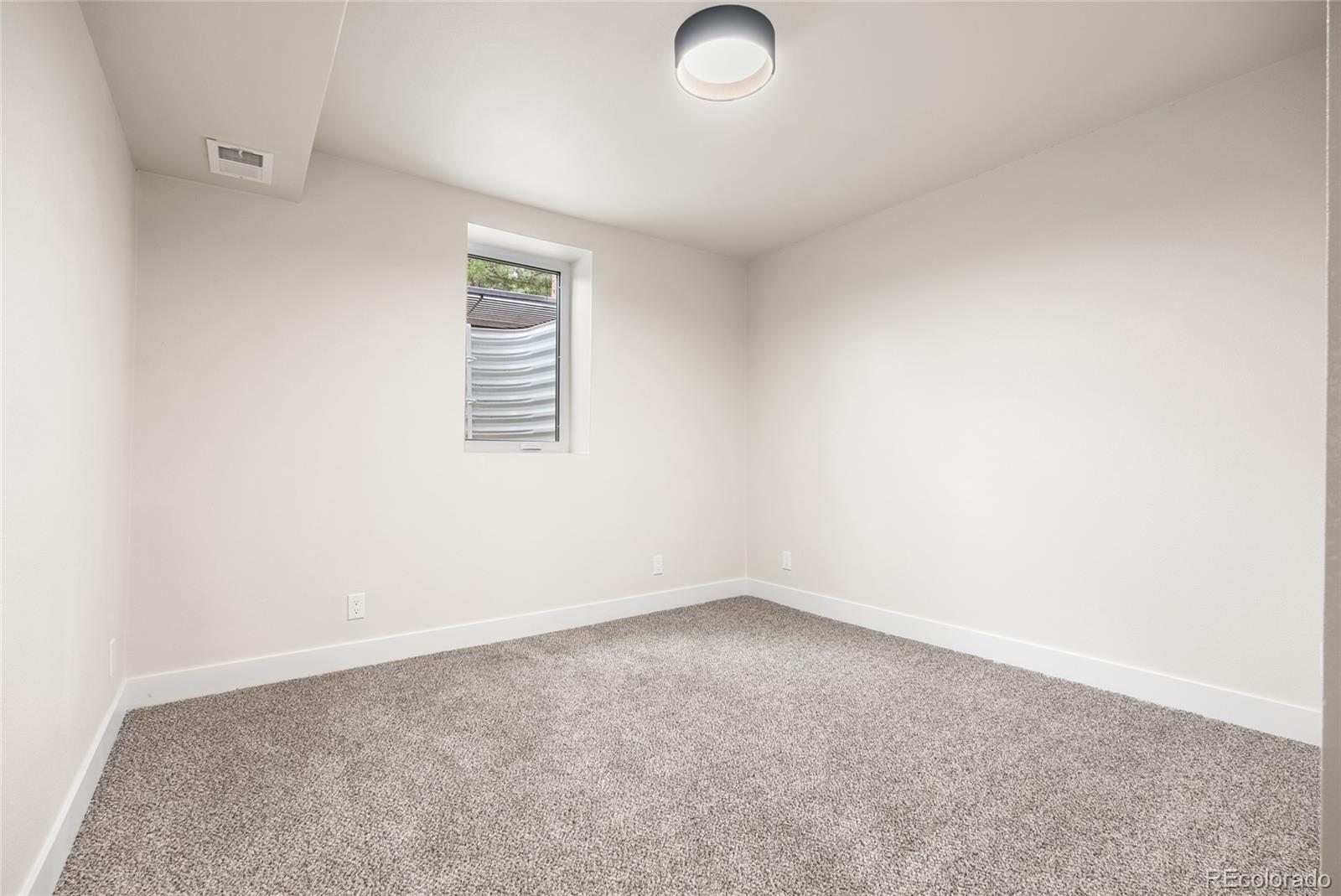 96 Moose Road Lyons, CO 80540 - Photo 29 of 39 an empty room with a window