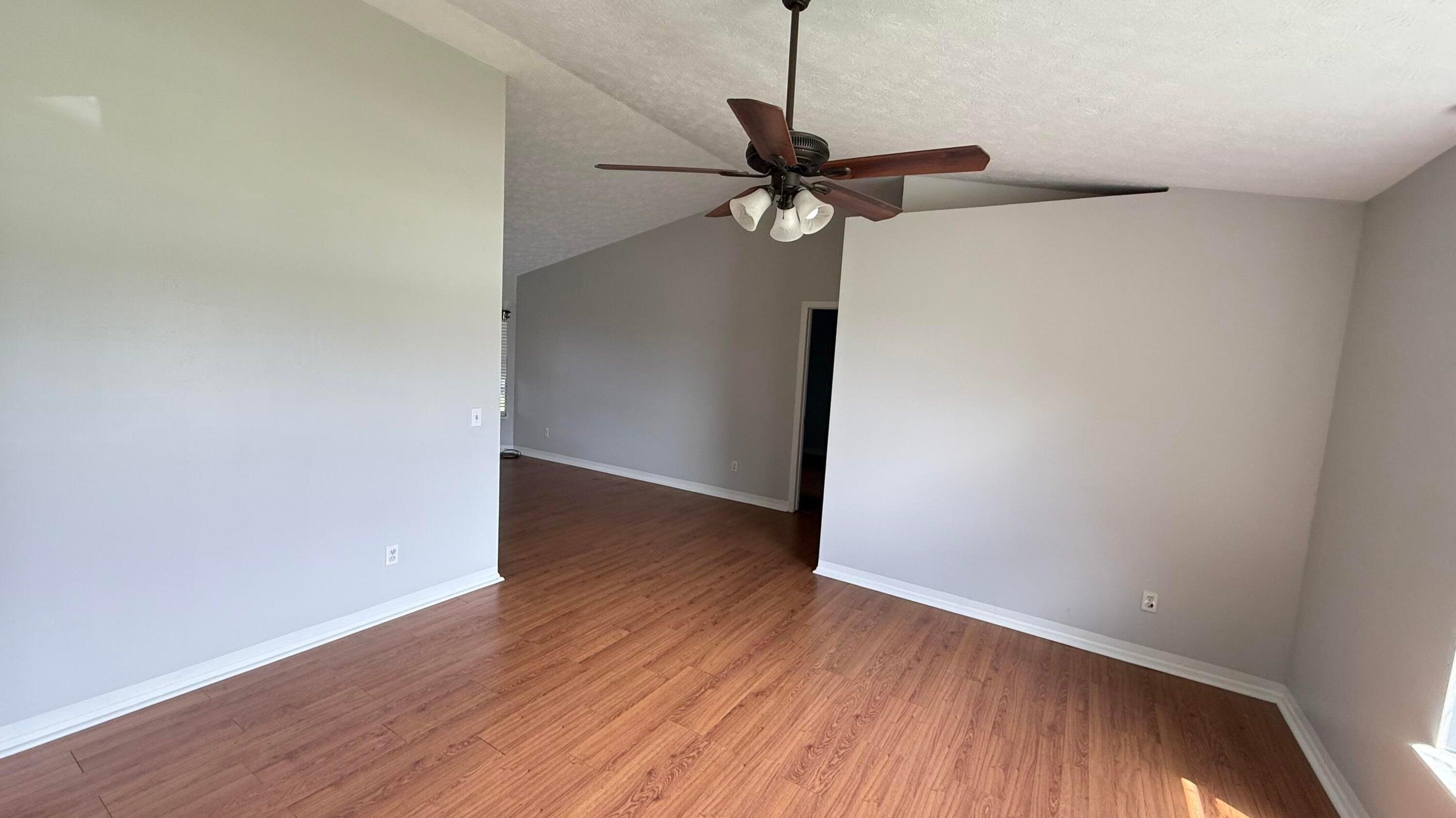 901 Southwest Gaitor Avenue Port St. Lucie, FL 34953 - Photo 8 of 11 a view of a room with wooden floor