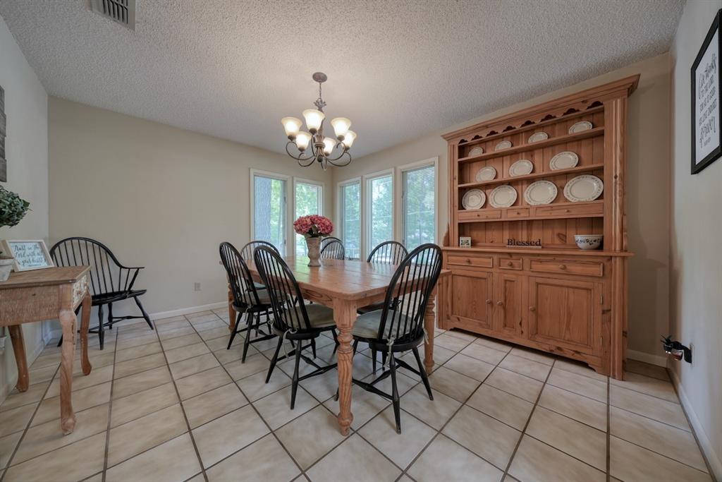 1649 Morningside Trail Hideaway, TX 75771 - Photo 15 of 40 a view of a dining room with furniture and chandelier
