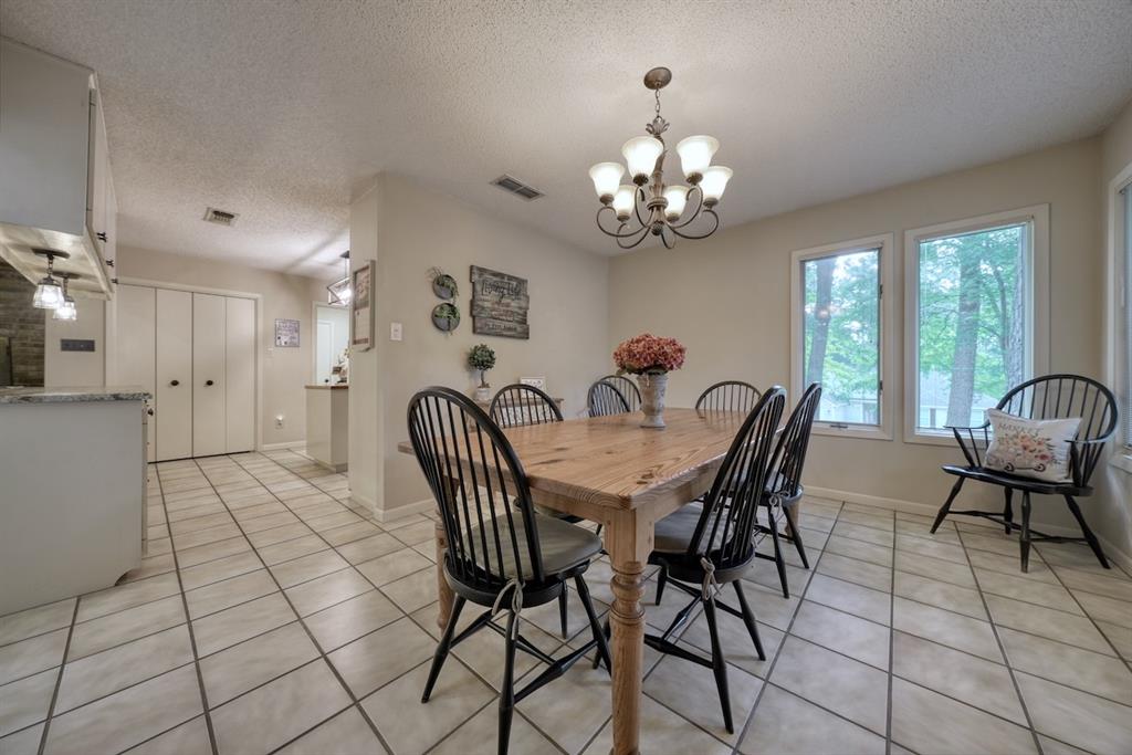 1649 Morningside Trail Hideaway, TX 75771 - Photo 16 of 40 a view of a dining room with furniture and chandelier