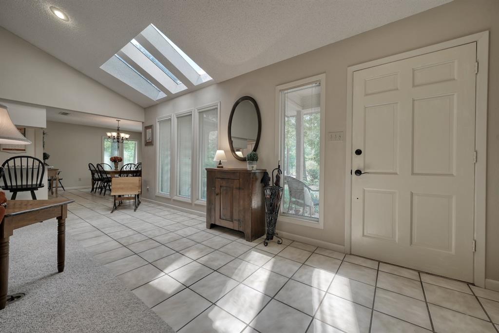 1649 Morningside Trail Hideaway, TX 75771 - Photo 2 of 40 a living room with furniture and a entryway