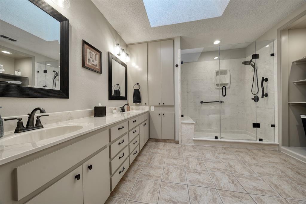 1649 Morningside Trail Hideaway, TX 75771 - Photo 26 of 40 a spacious bathroom with double sink and shower