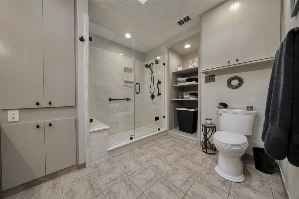 1649 Morningside Trail Hideaway, TX 75771 - Photo 27 of 40 a bathroom with a toilet sink and shower