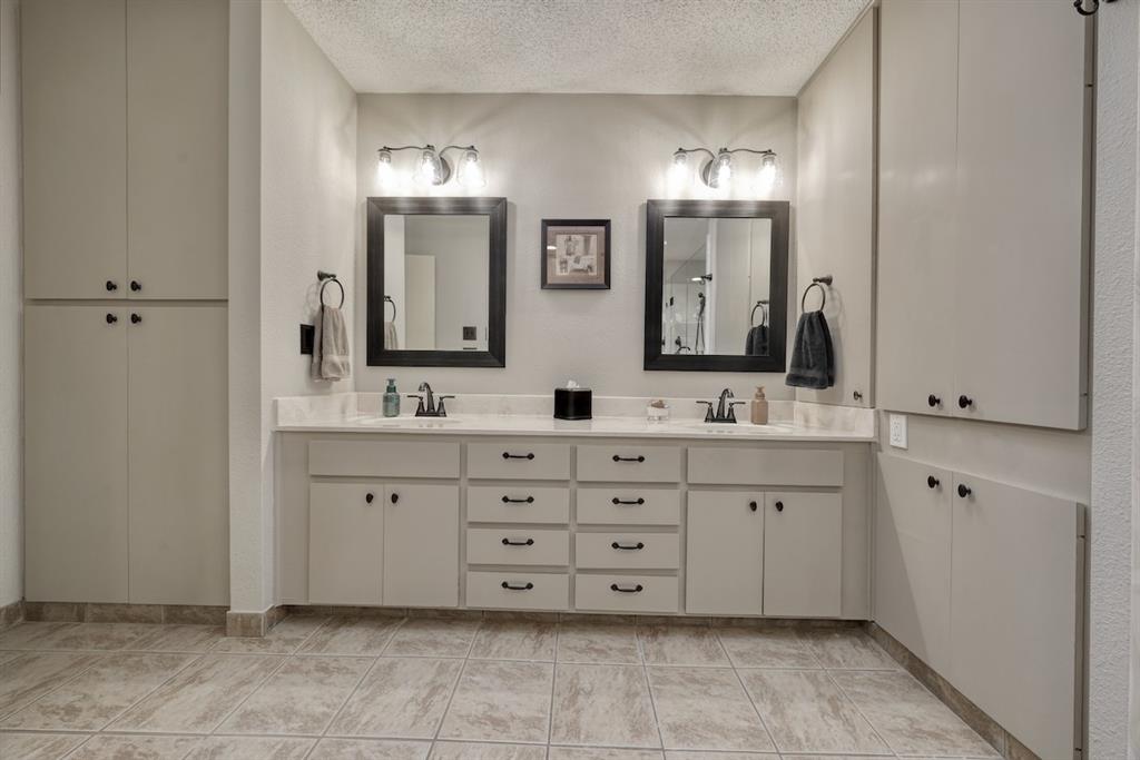 1649 Morningside Trail Hideaway, TX 75771 - Photo 28 of 40 a bathroom with double sink and a mirror