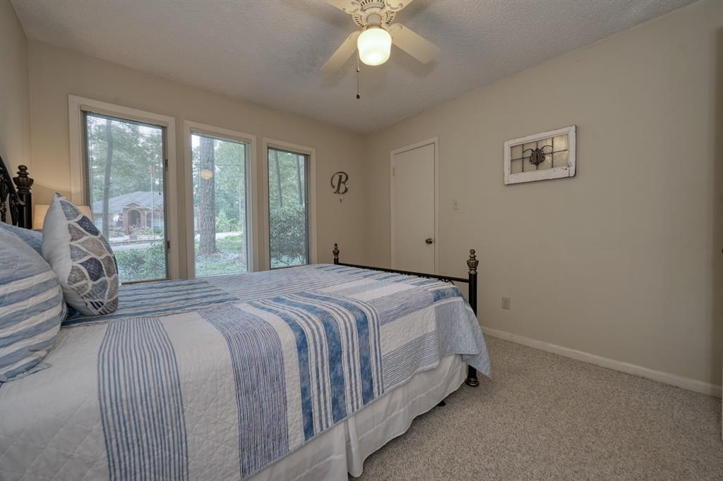 1649 Morningside Trail Hideaway, TX 75771 - Photo 30 of 40 a bedroom with a bed and a large window