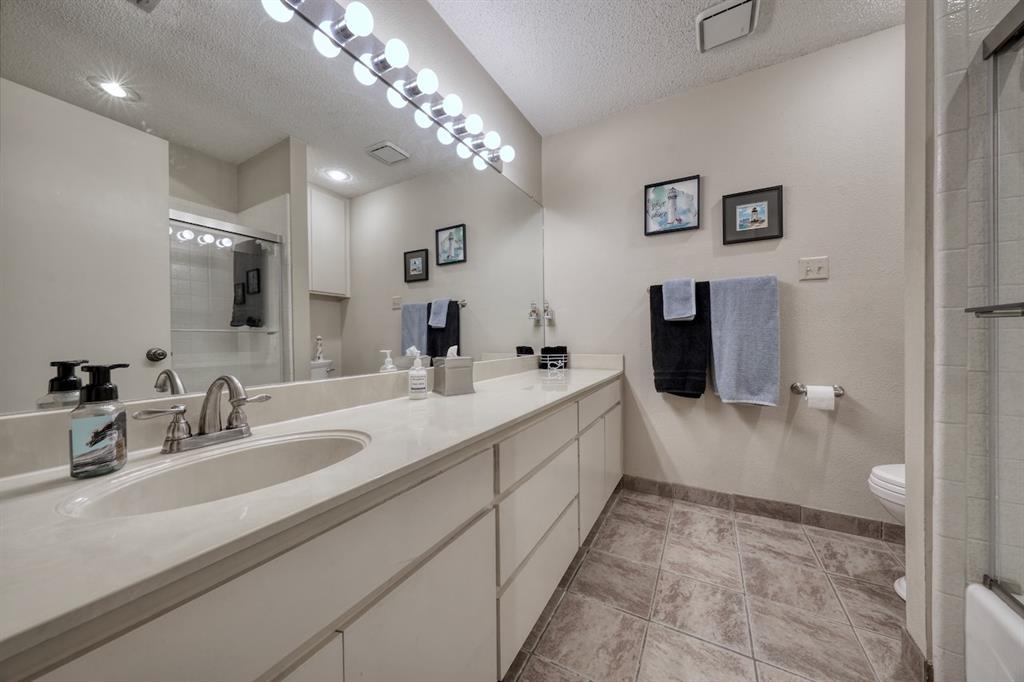 1649 Morningside Trail Hideaway, TX 75771 - Photo 32 of 40 a spacious bathroom with a double vanity sink mirror and shower