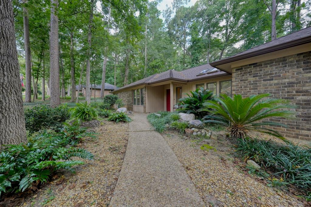 1649 Morningside Trail Hideaway, TX 75771 - Photo 37 of 40 a view of a yard with plants and trees