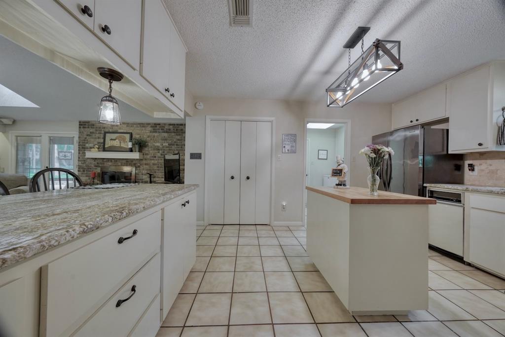 1649 Morningside Trail Hideaway, TX 75771 - Photo 8 of 40 a large white kitchen with a stove a sink dishwasher and a refrigerator