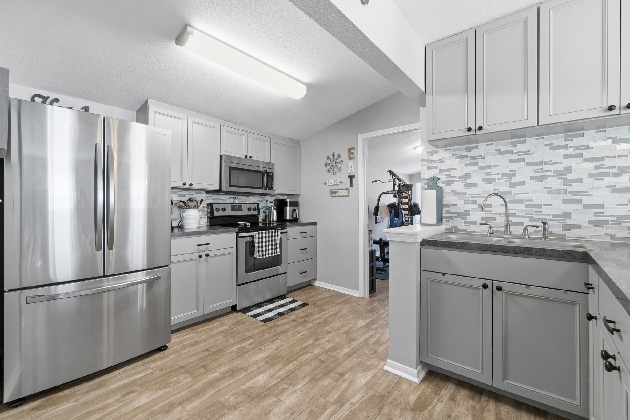 192 Miller Road Livingston, TX 77351 - Photo 13 of 36 a kitchen with a refrigerator stove and sink