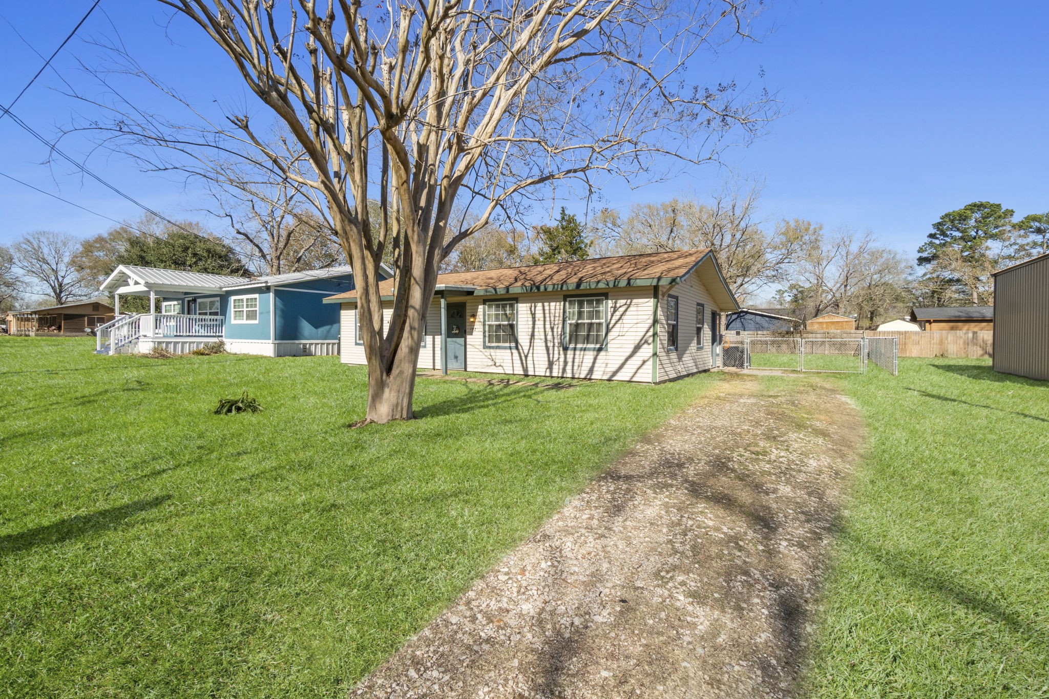 192 Miller Road Livingston, TX 77351 - Photo 2 of 36 a view of a yard in front of a house