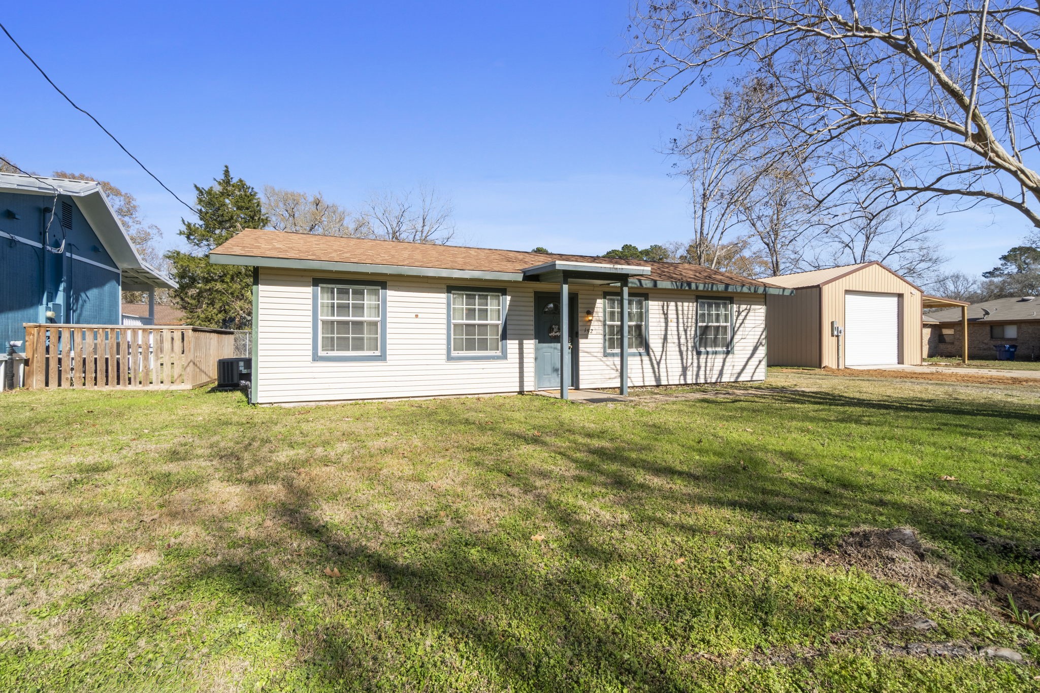 192 Miller Road Livingston, TX 77351 - Photo 30 of 36 a front view of a house with a garden