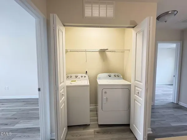 a view of bathroom with a washer and dryer