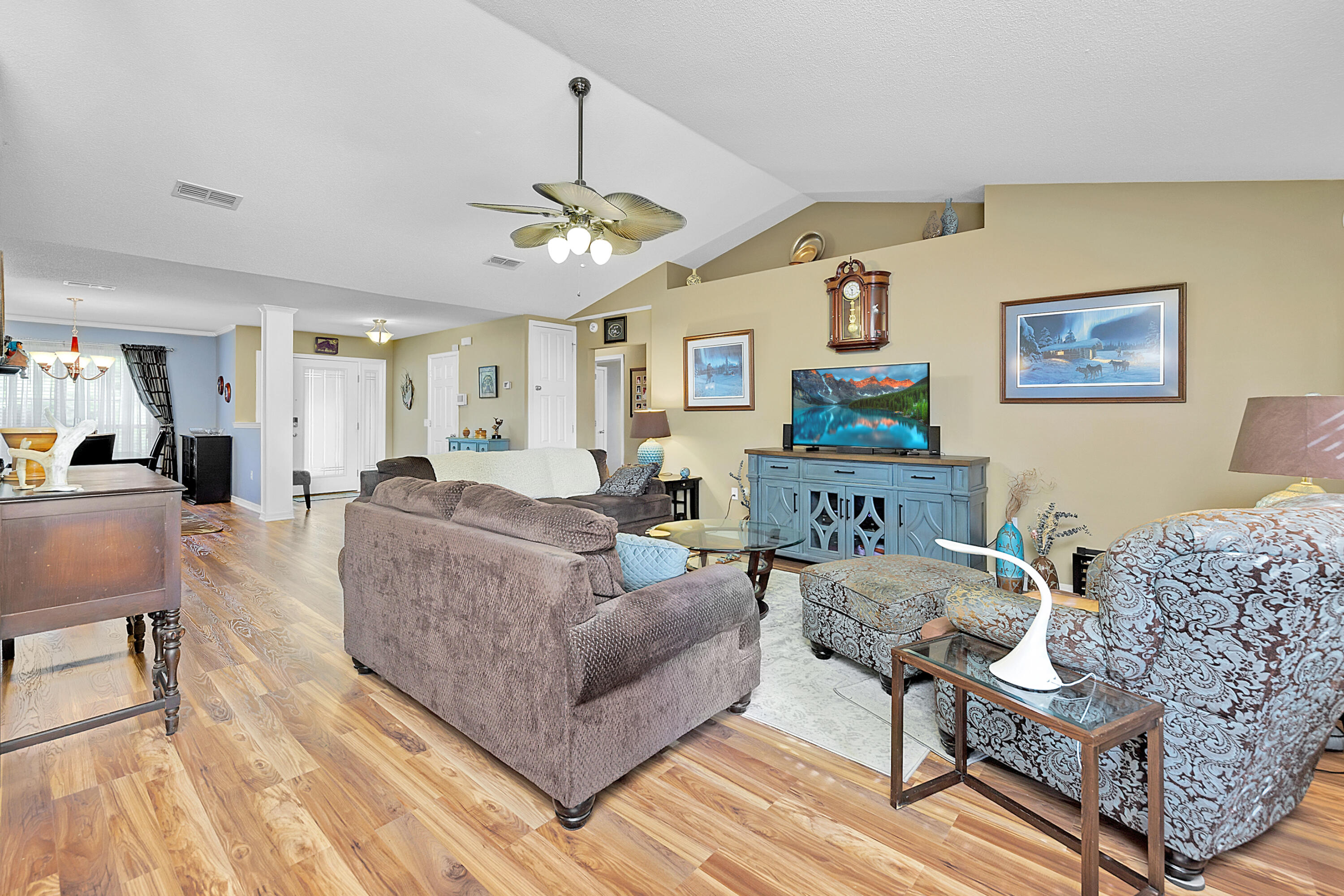 2389 Genevieve Way Crestview, FL 32536 - Photo 15 of 44 a living room with furniture and a chandelier