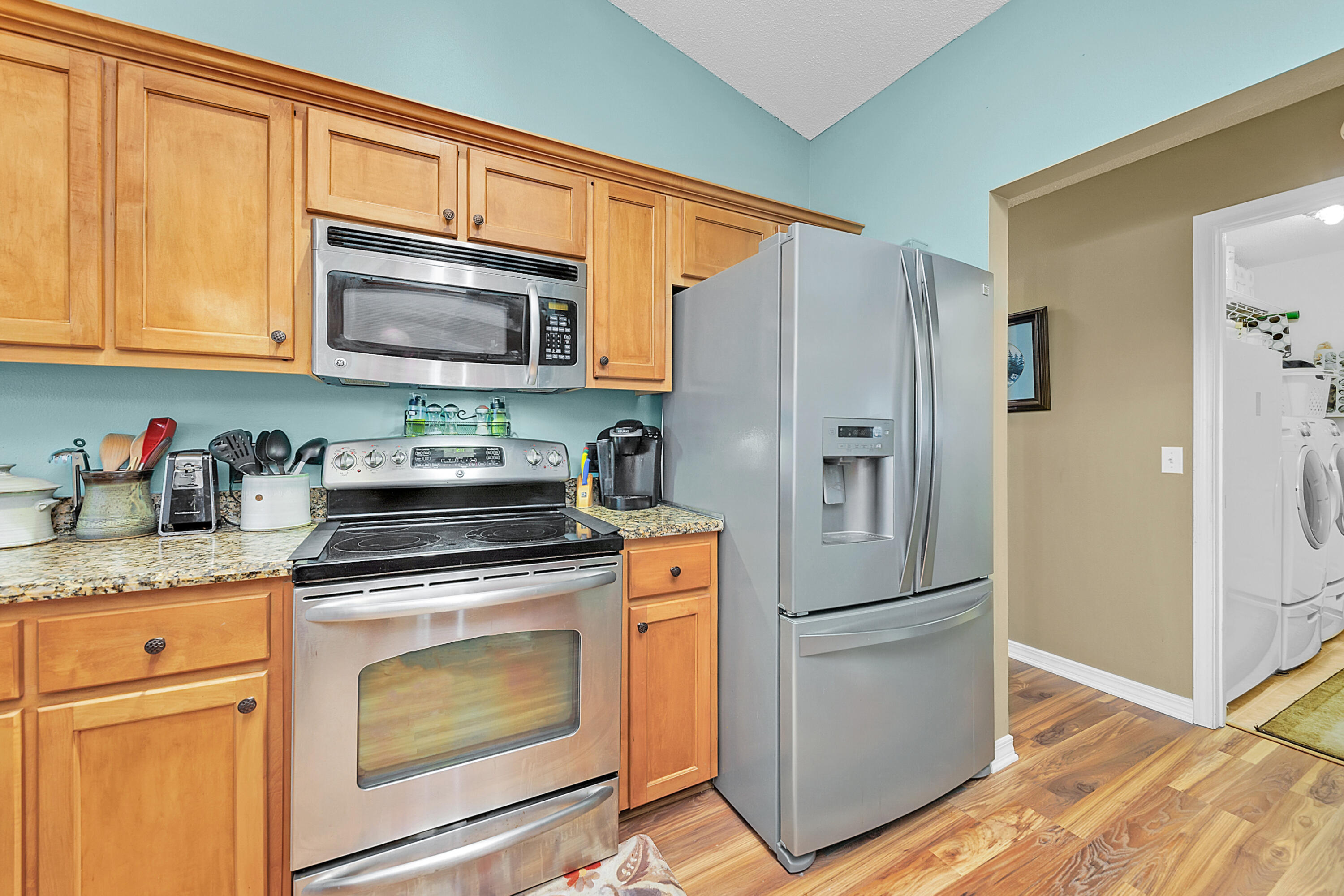 2389 Genevieve Way Crestview, FL 32536 - Photo 22 of 44 a kitchen with stainless steel appliances granite countertop a refrigerator stove and sink
