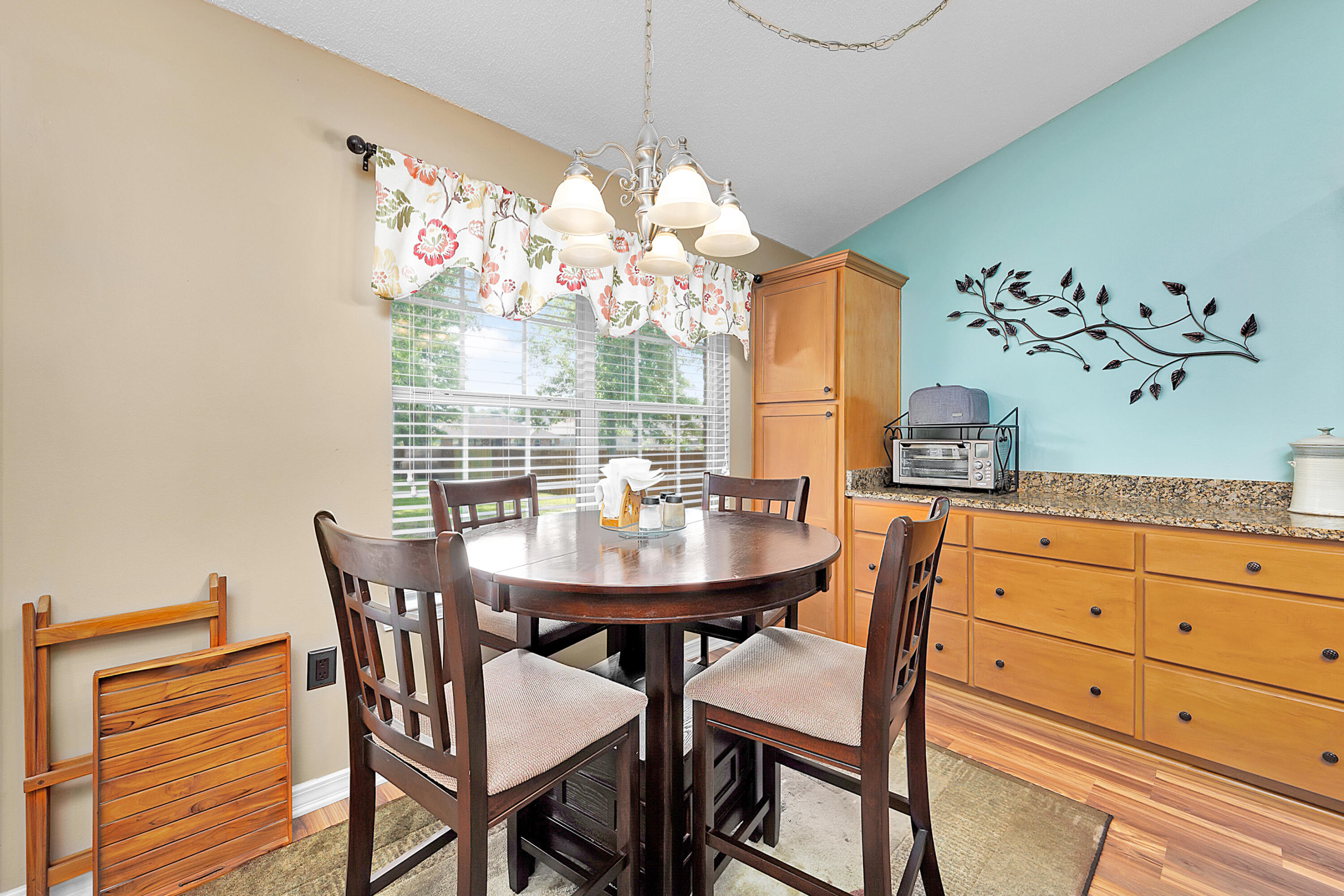 2389 Genevieve Way Crestview, FL 32536 - Photo 24 of 44 a view of a dining room with furniture and chandelier