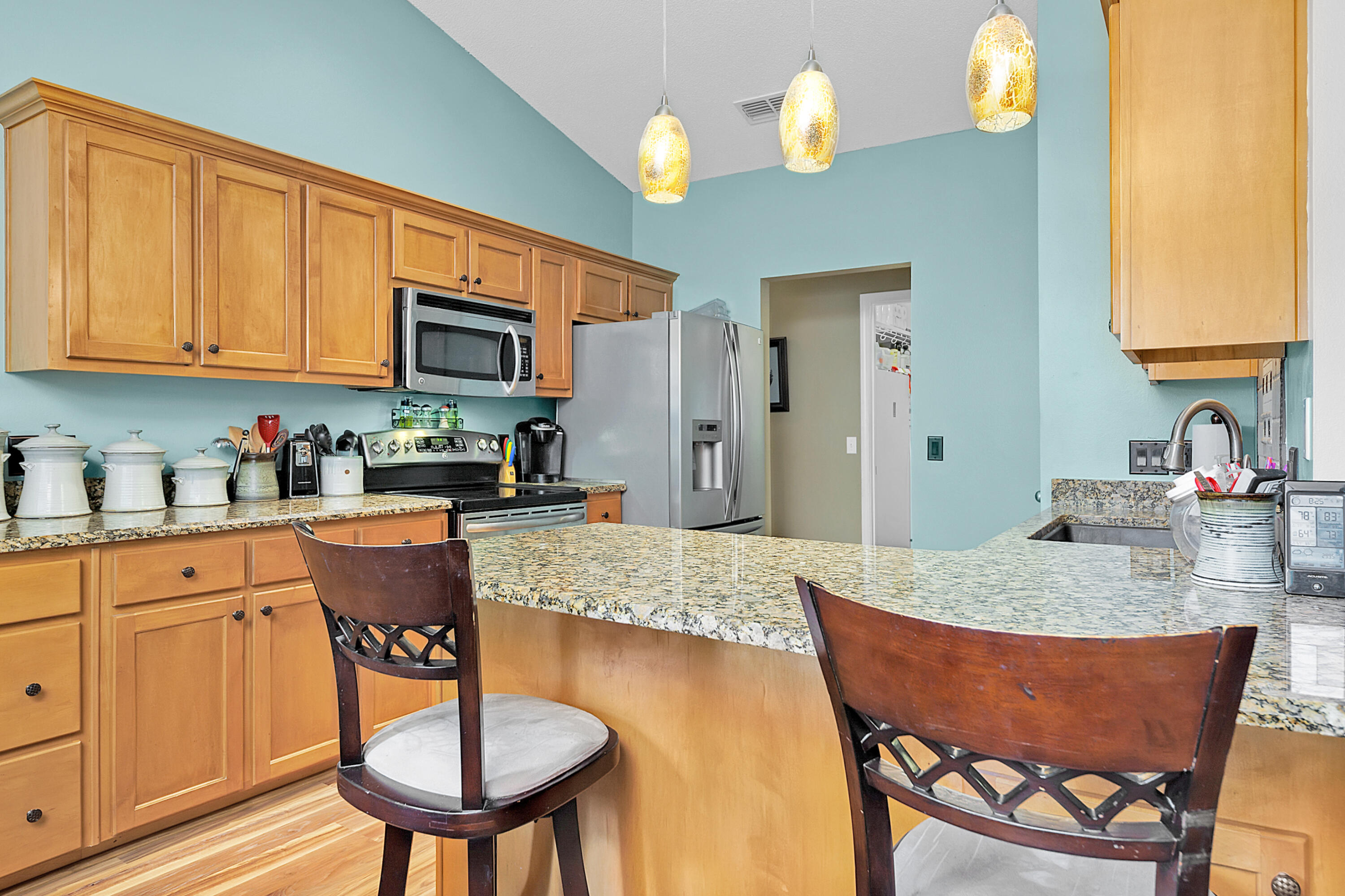 2389 Genevieve Way Crestview, FL 32536 - Photo 26 of 44 a kitchen with a dining table chairs and chandelier
