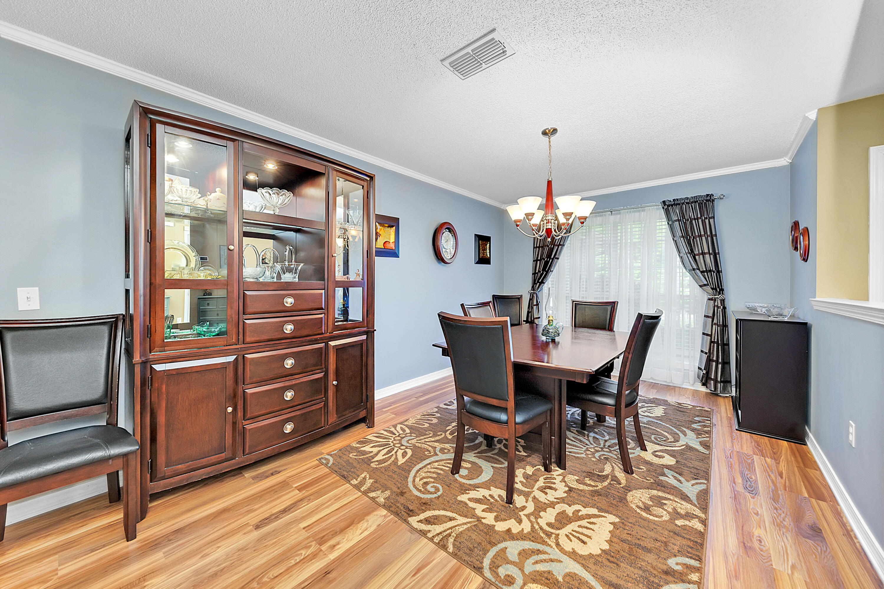 2389 Genevieve Way Crestview, FL 32536 - Photo 28 of 44 a dining room with furniture window and wooden floor