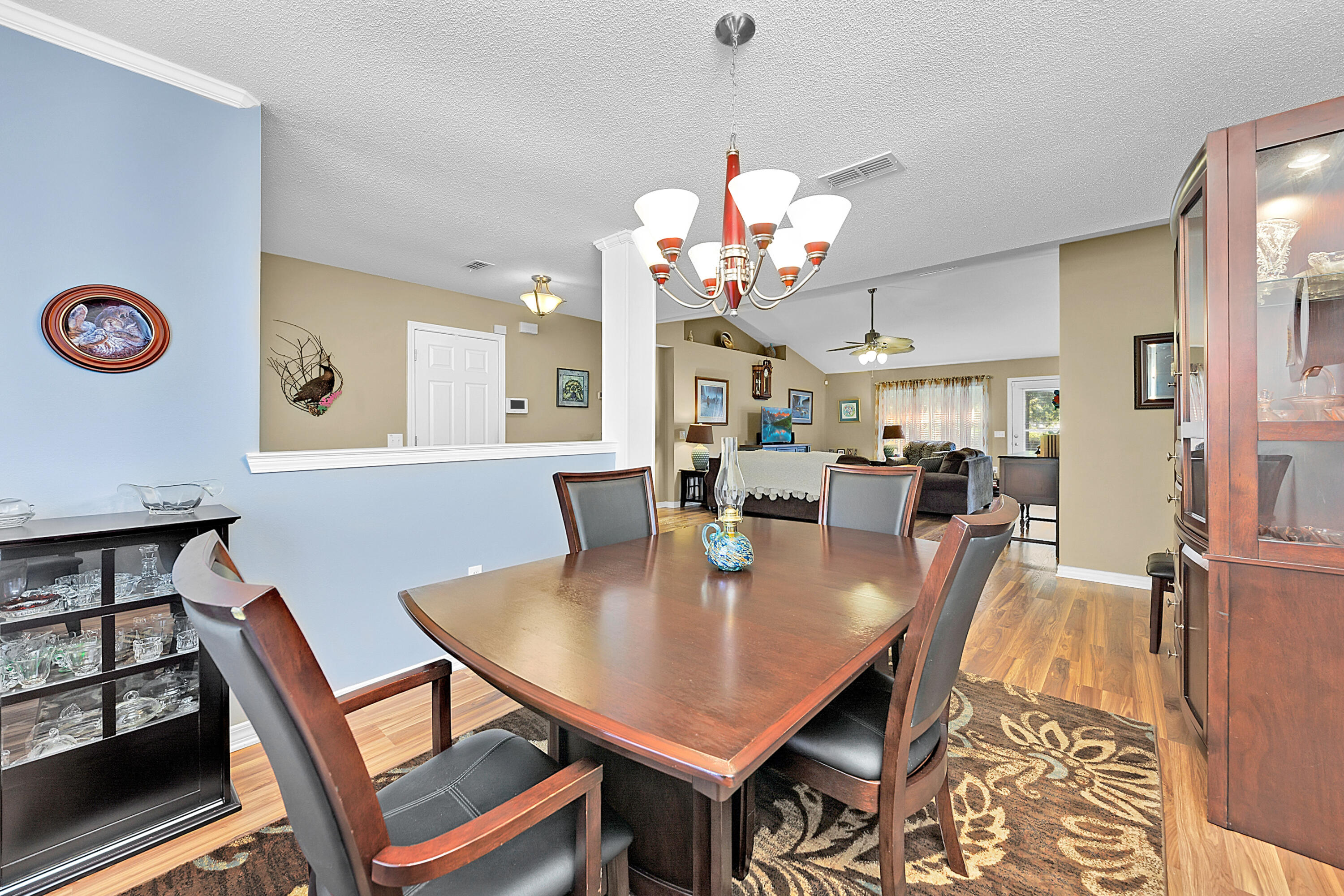 2389 Genevieve Way Crestview, FL 32536 - Photo 29 of 44 a view of a dining room with furniture and chandelier
