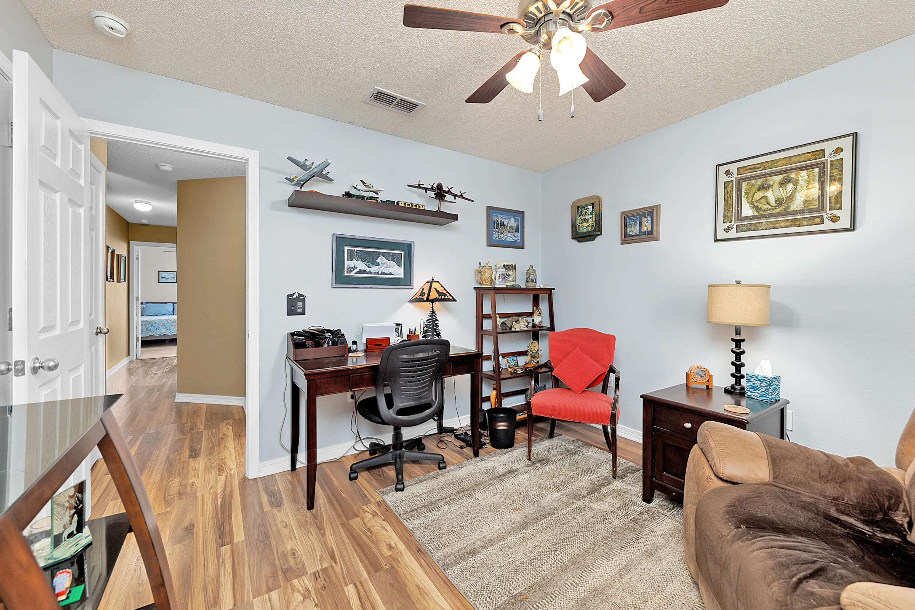 2389 Genevieve Way Crestview, FL 32536 - Photo 30 of 44 a living room with furniture and wooden floor